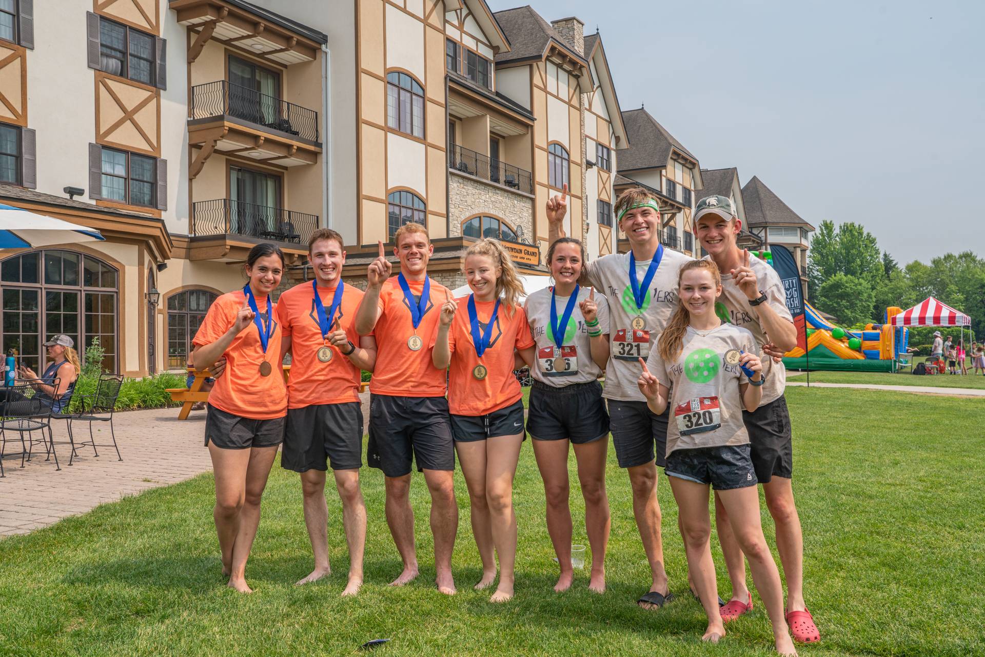 Team of Dirty Dog Dash racers with winning medals at awards ceremony