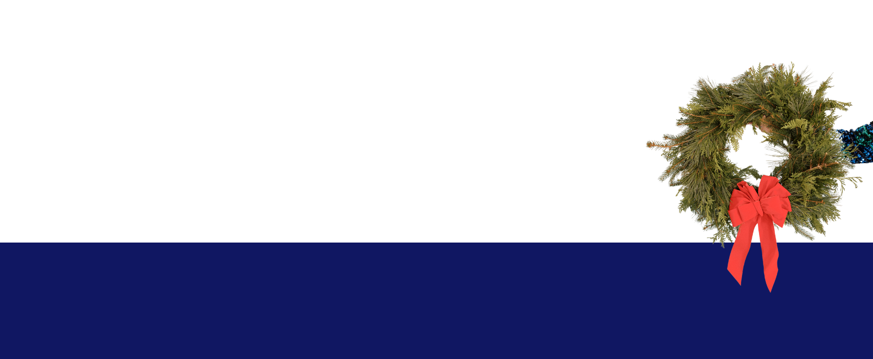 Wreath with a big red bow being held up by hand