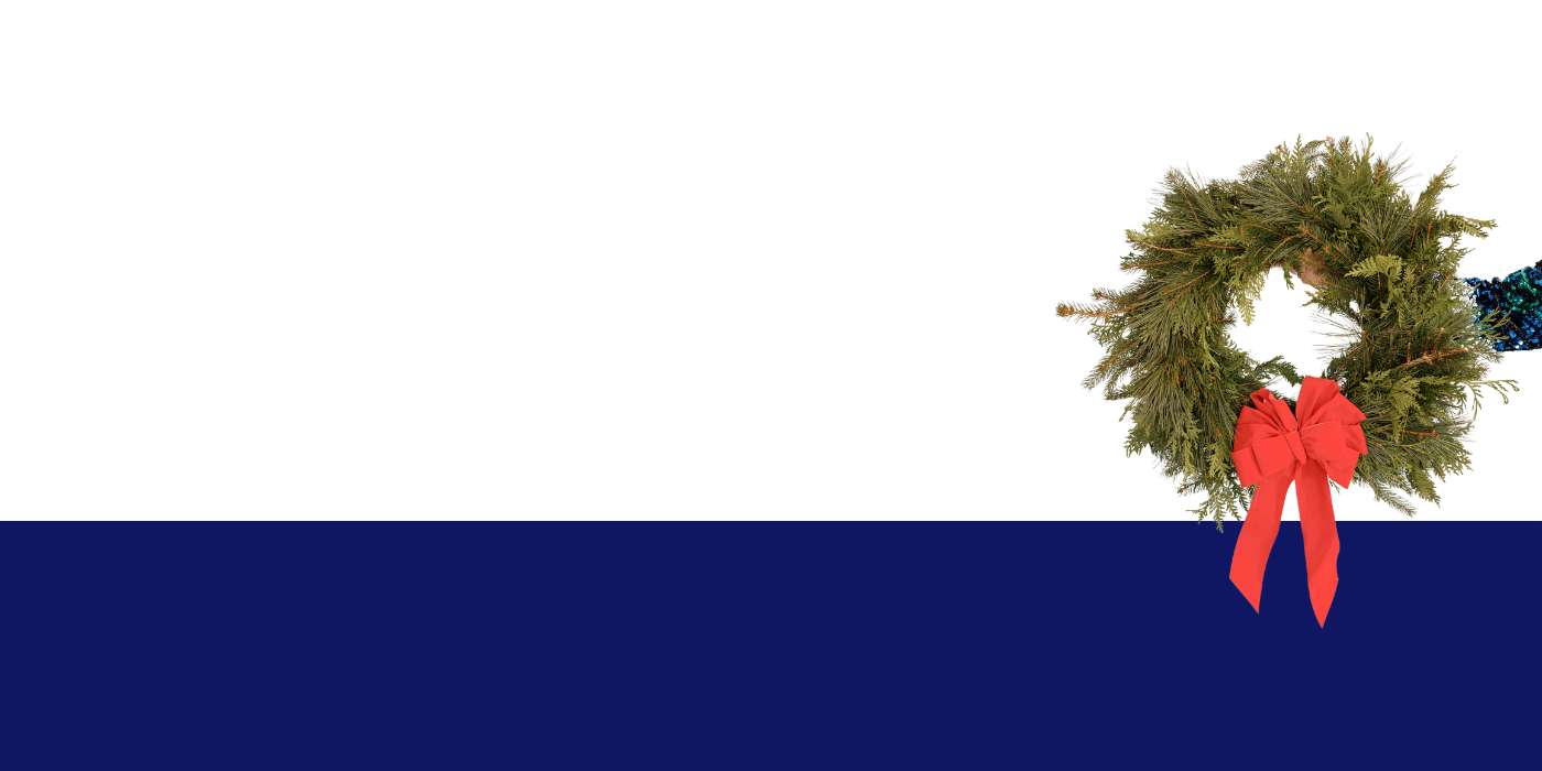 Wreath with a big red bow being held up by hand