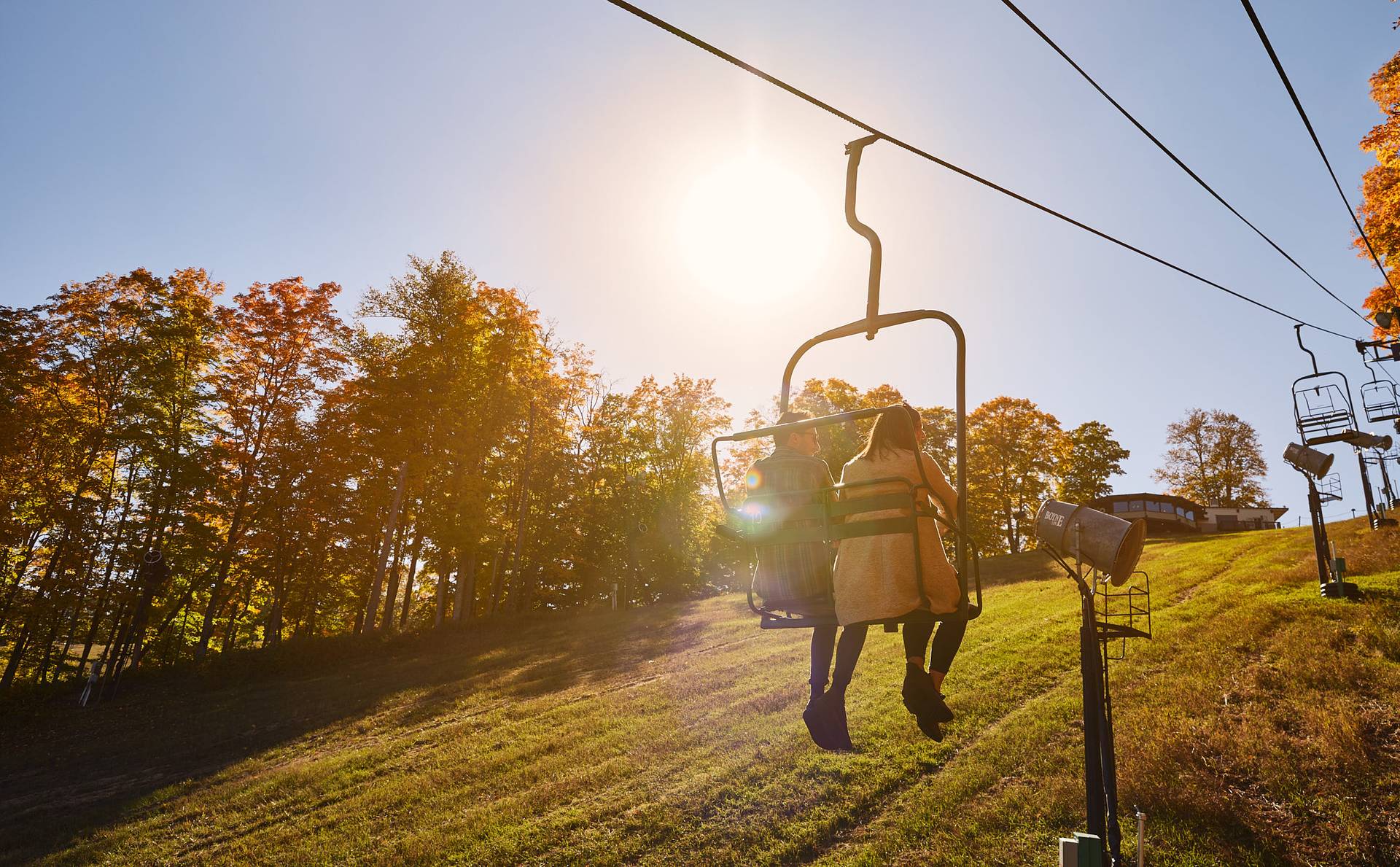 Family walking under SkyBridge towers