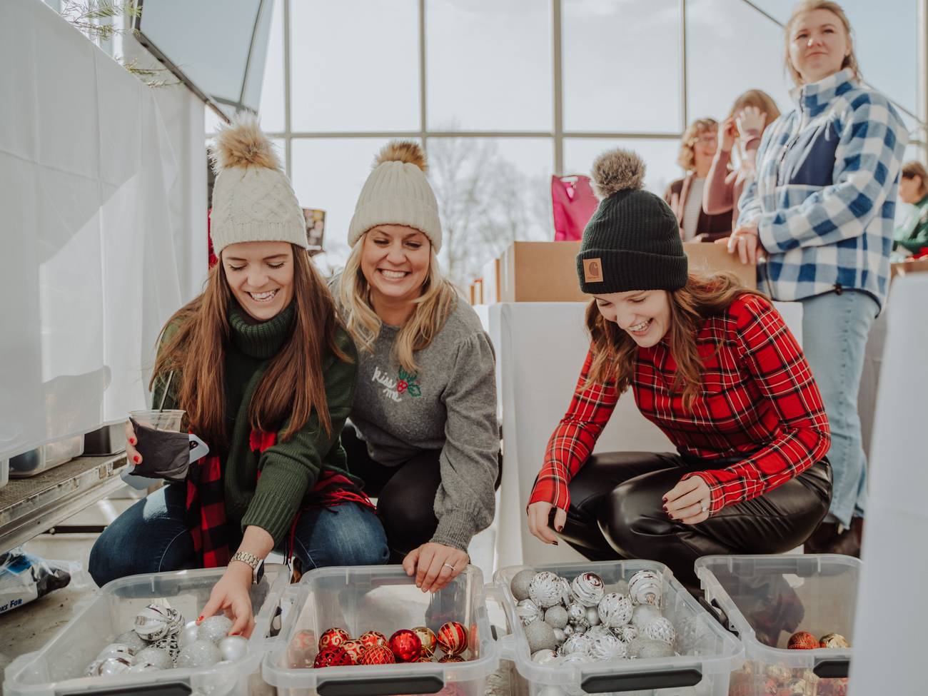Ladies picking out ornaments