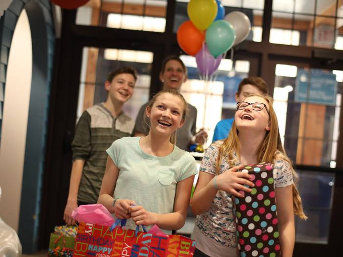 Kids walking into waterpark for birthday