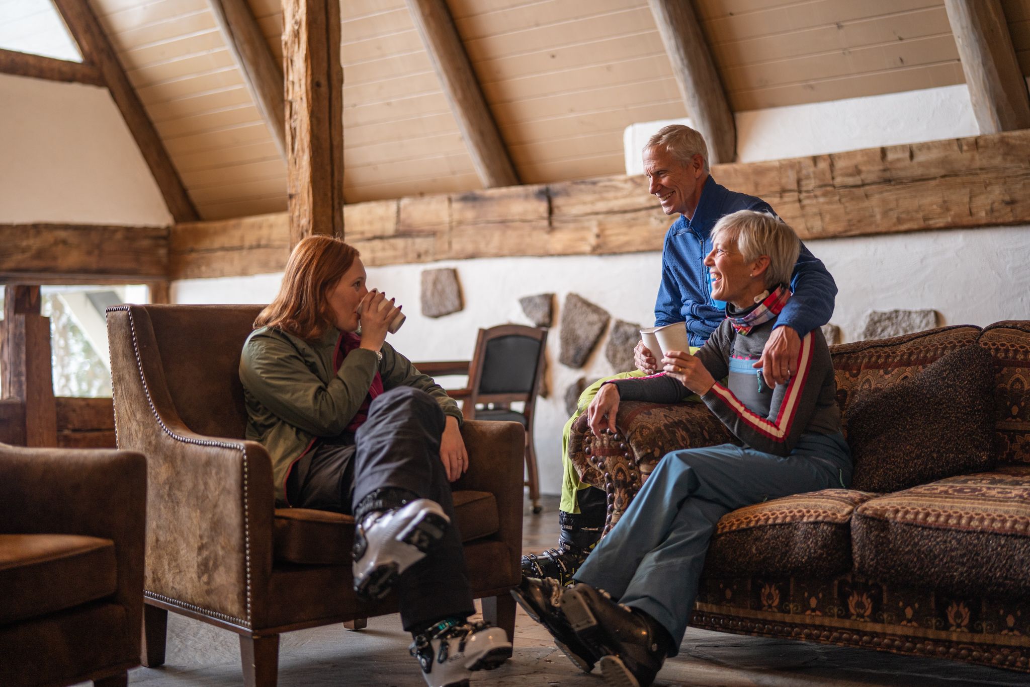 skiers in lobby of Boynehof Lodge