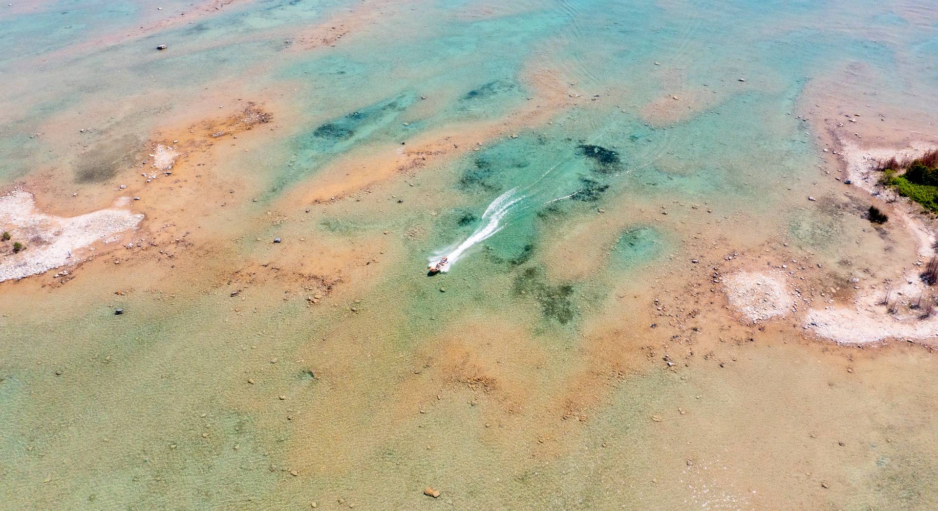 Boat speeding through water on Sturgeon Bay.