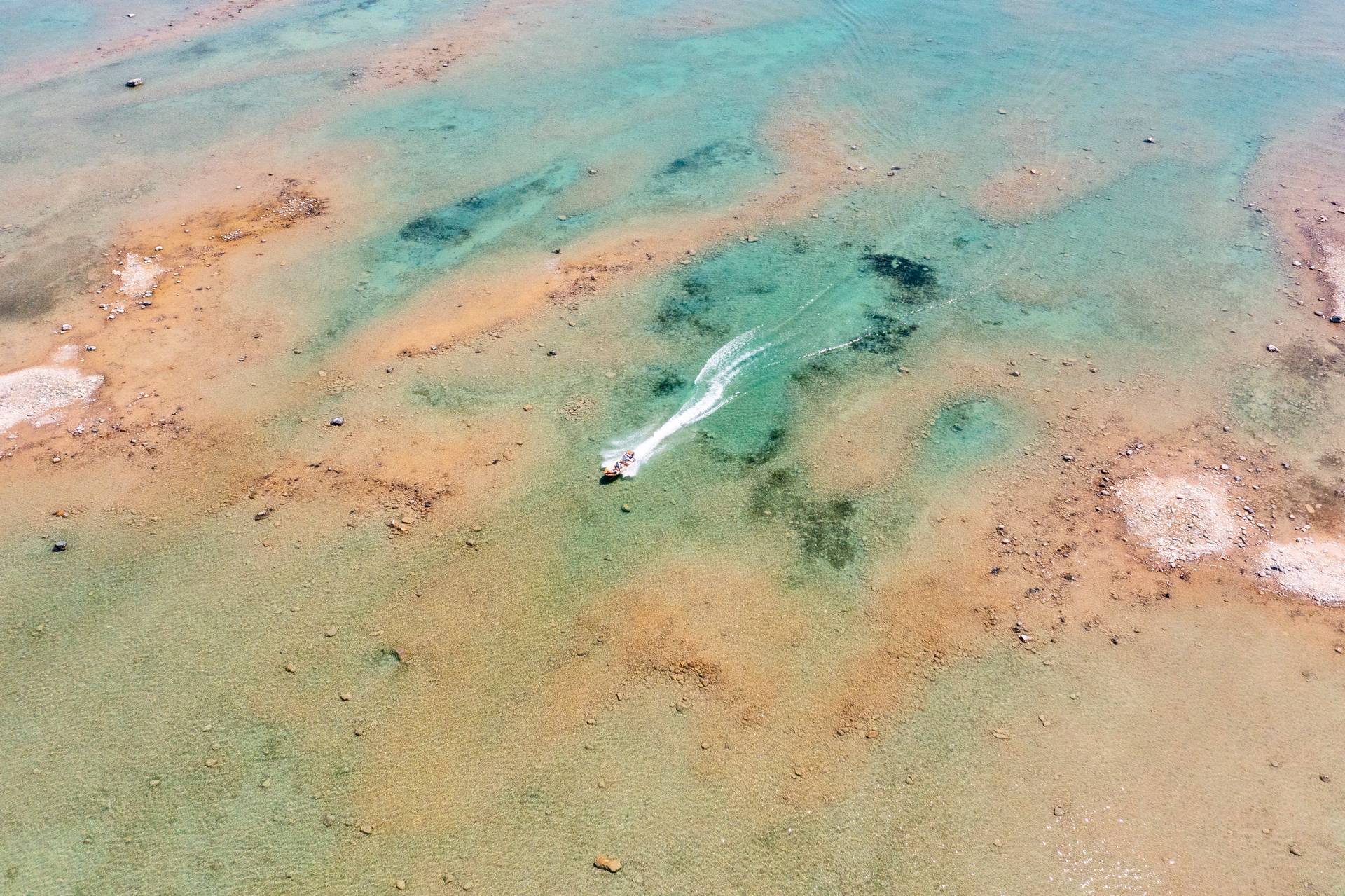 Boat speeding through water on Sturgeon Bay.