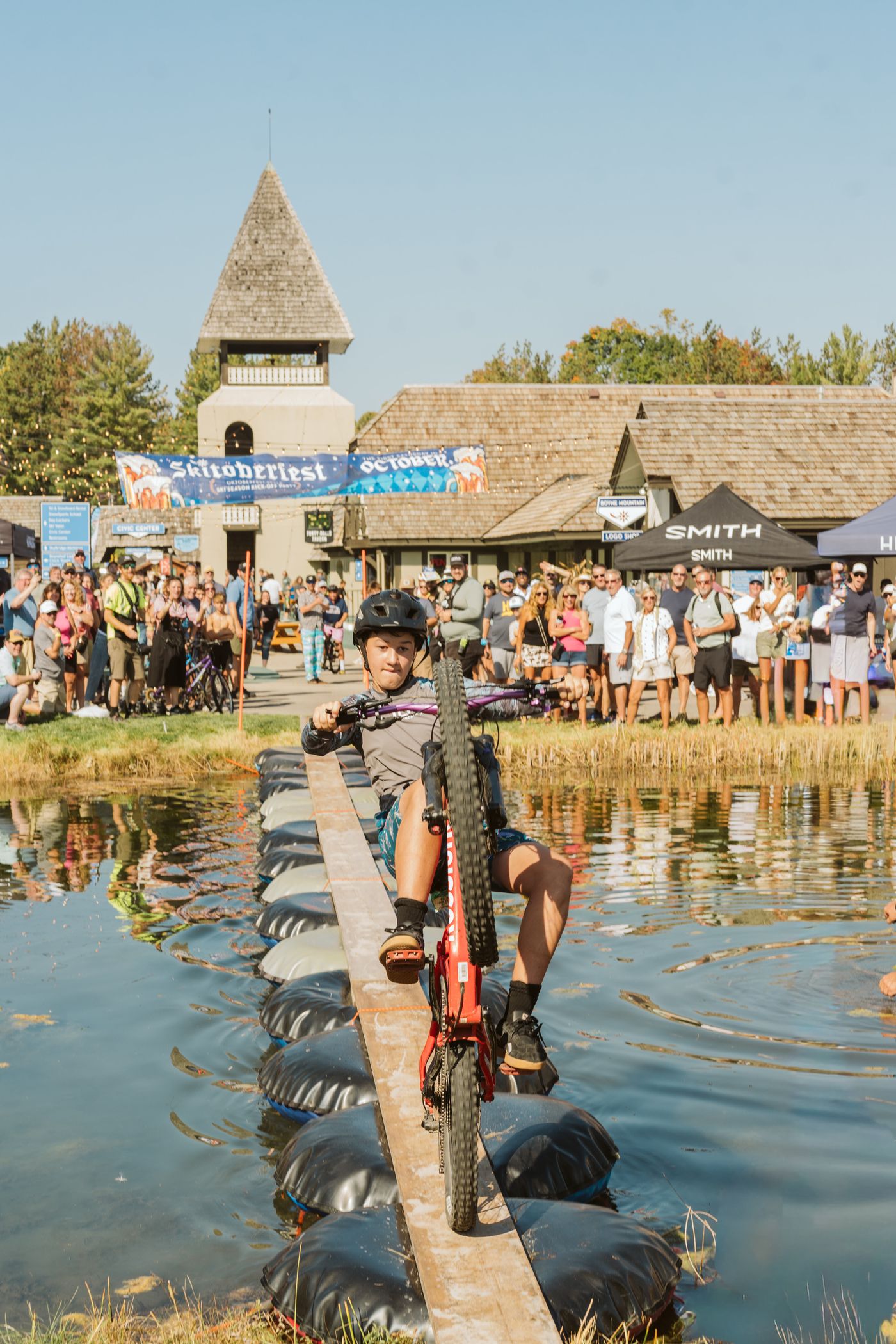 kids popping wheelie at skitoberfest pond pedal