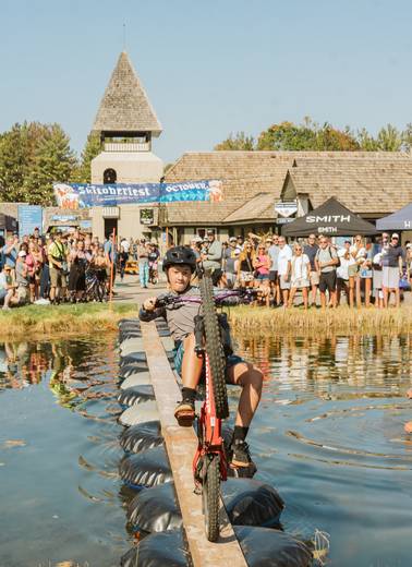kids popping wheelie at skitoberfest pond pedal