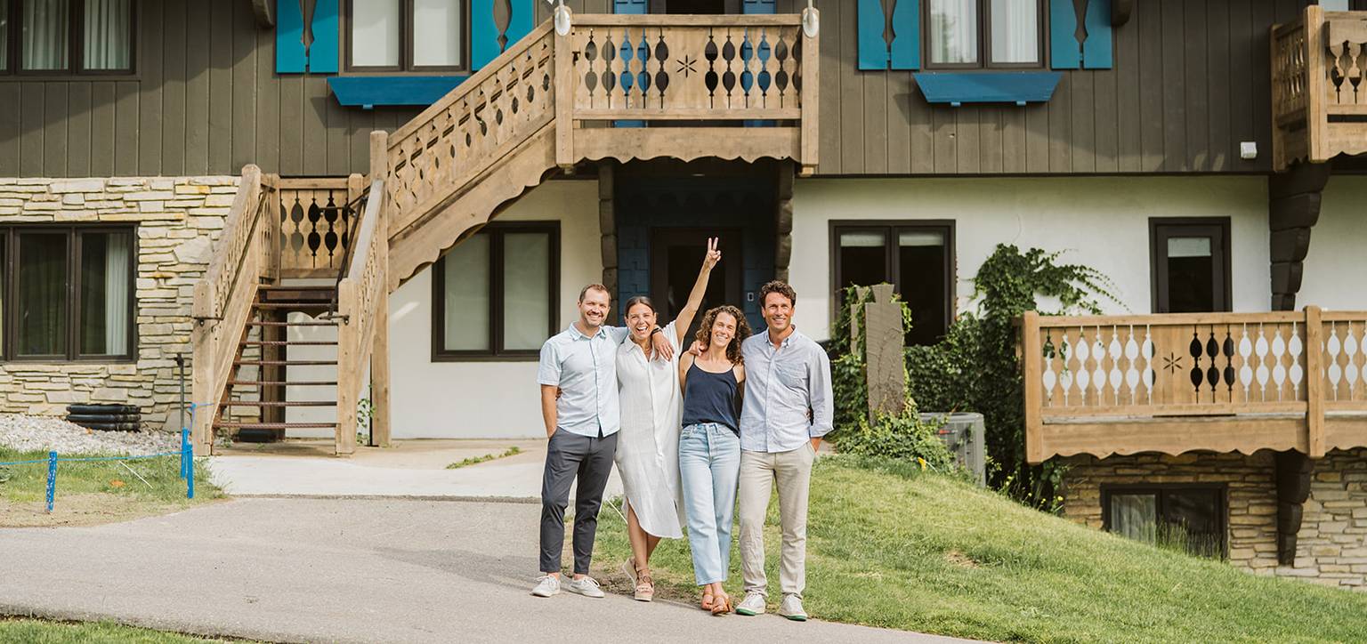 Two couples walking out of Chalet Edelweiss