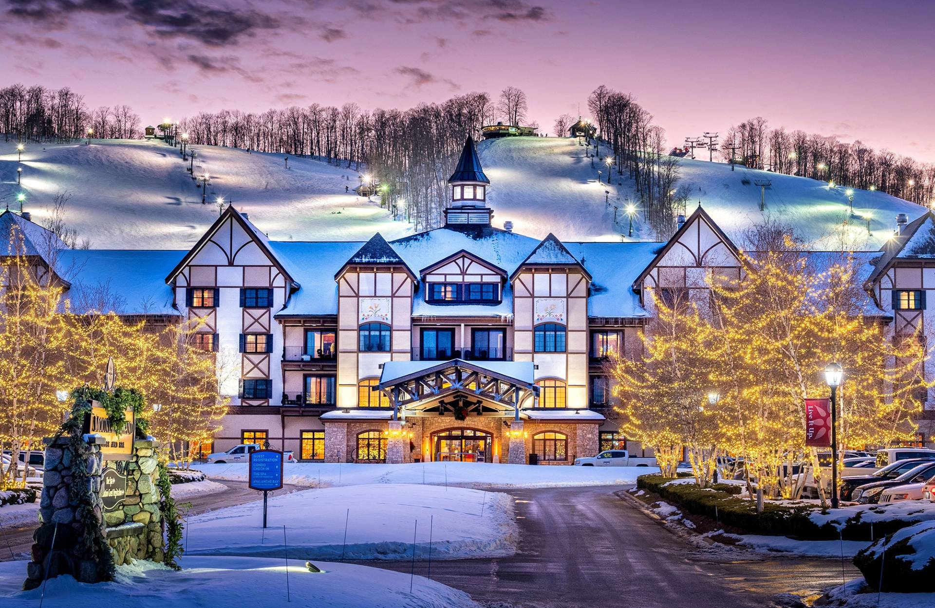 Exterior front view of Mountain Grand Lodge and Spa with a beautiful sunset