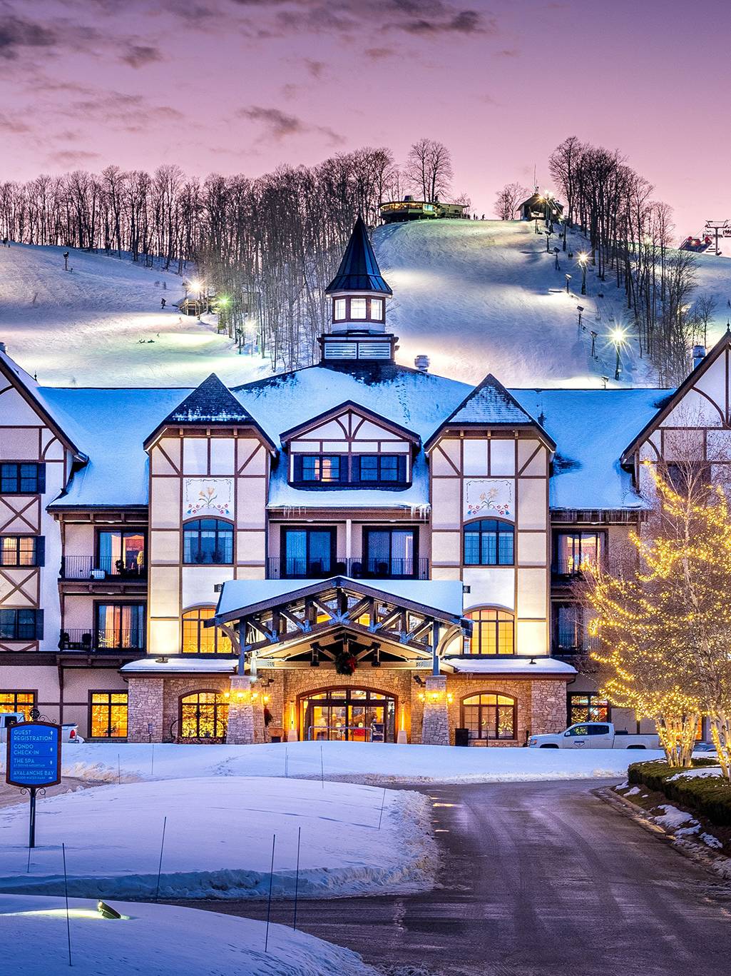 Mountain Grand Lodge and Spa lit up with lights in the winter