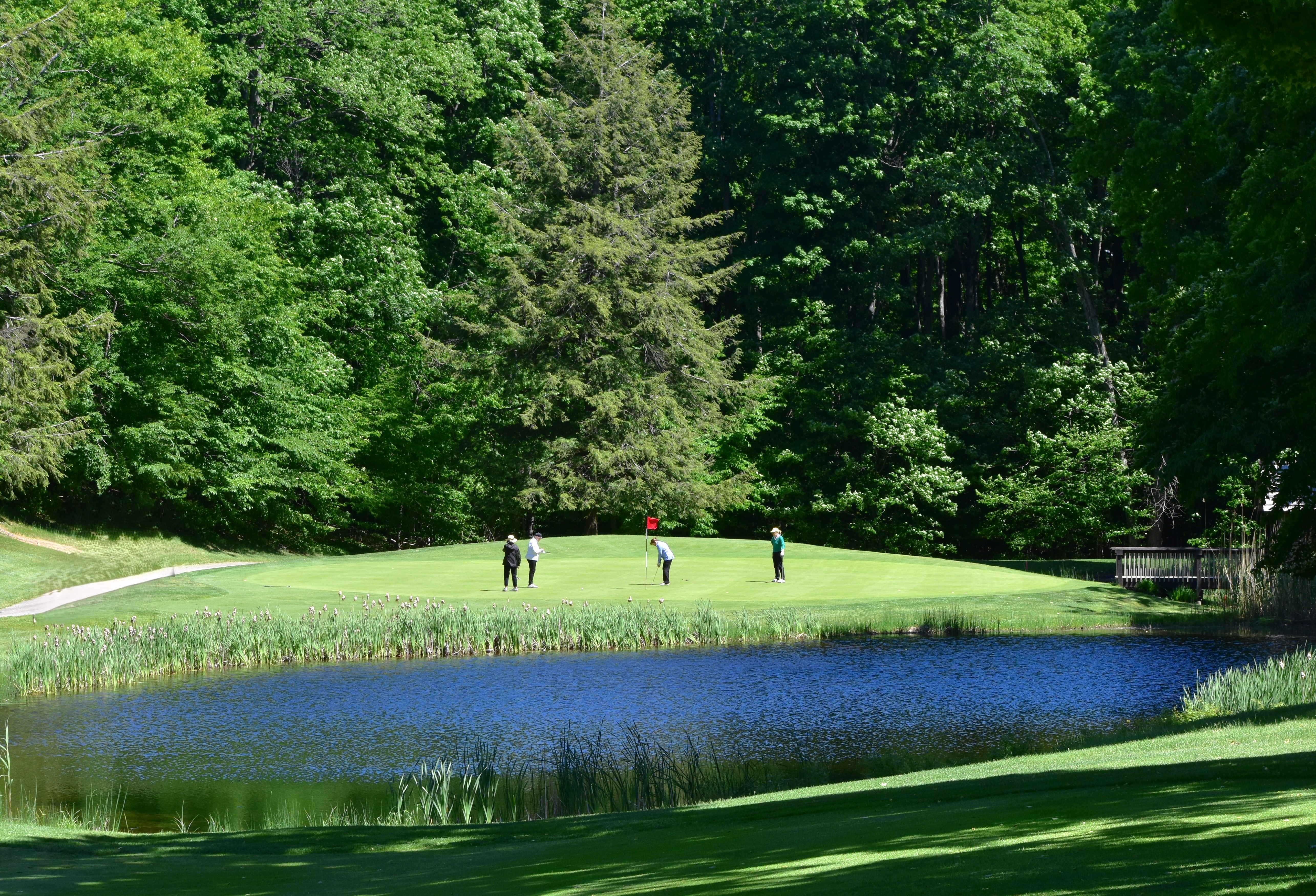 group of golfers on monument