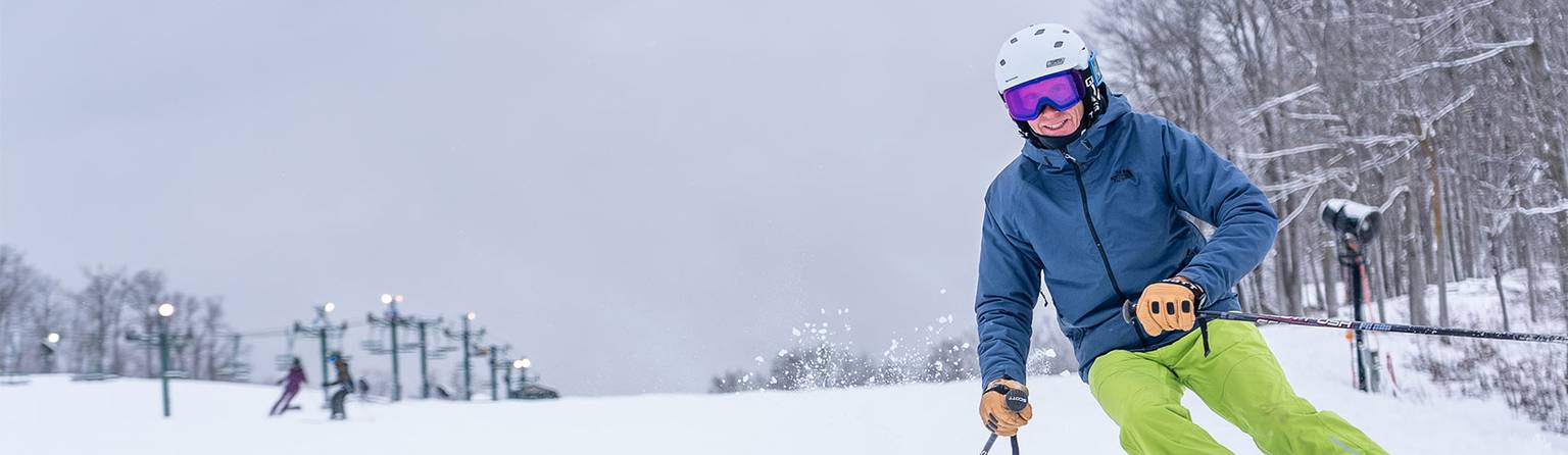 man skiing down the hill