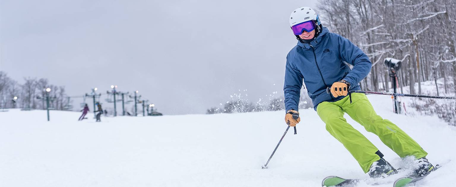 man skiing down the hill
