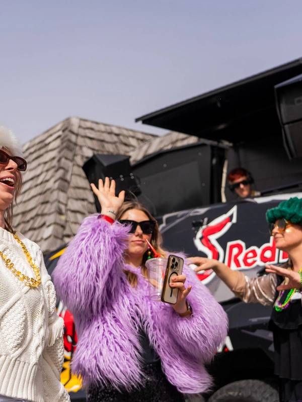 People partying in front of the Red Bull Truck in the Base Area of the Mountain
