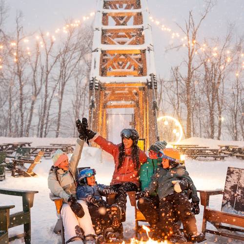 family at skybridge in the winter