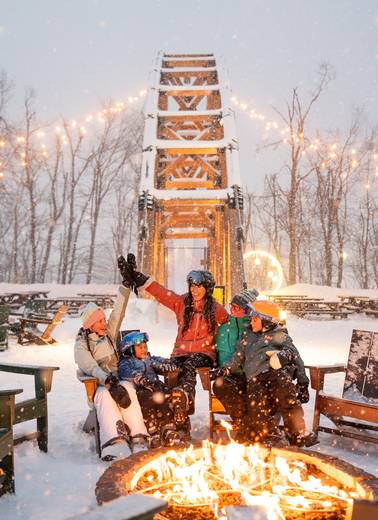 family sitting fireside