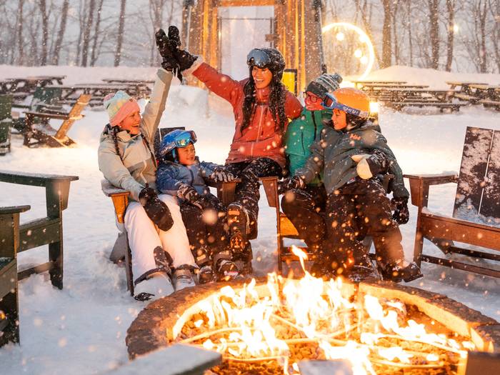 family sitting fireside