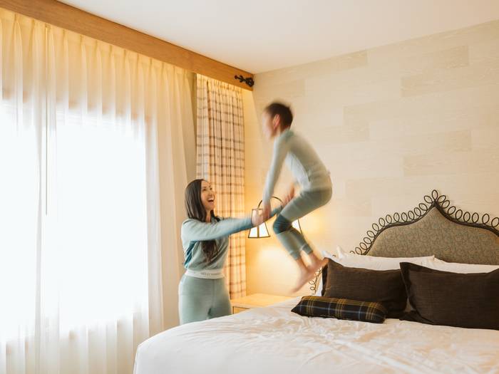 mom and son in hotel room