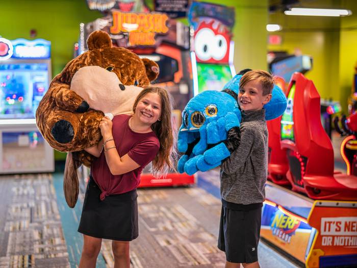 Kids with prizes at Arcade at Boyne Mountain.