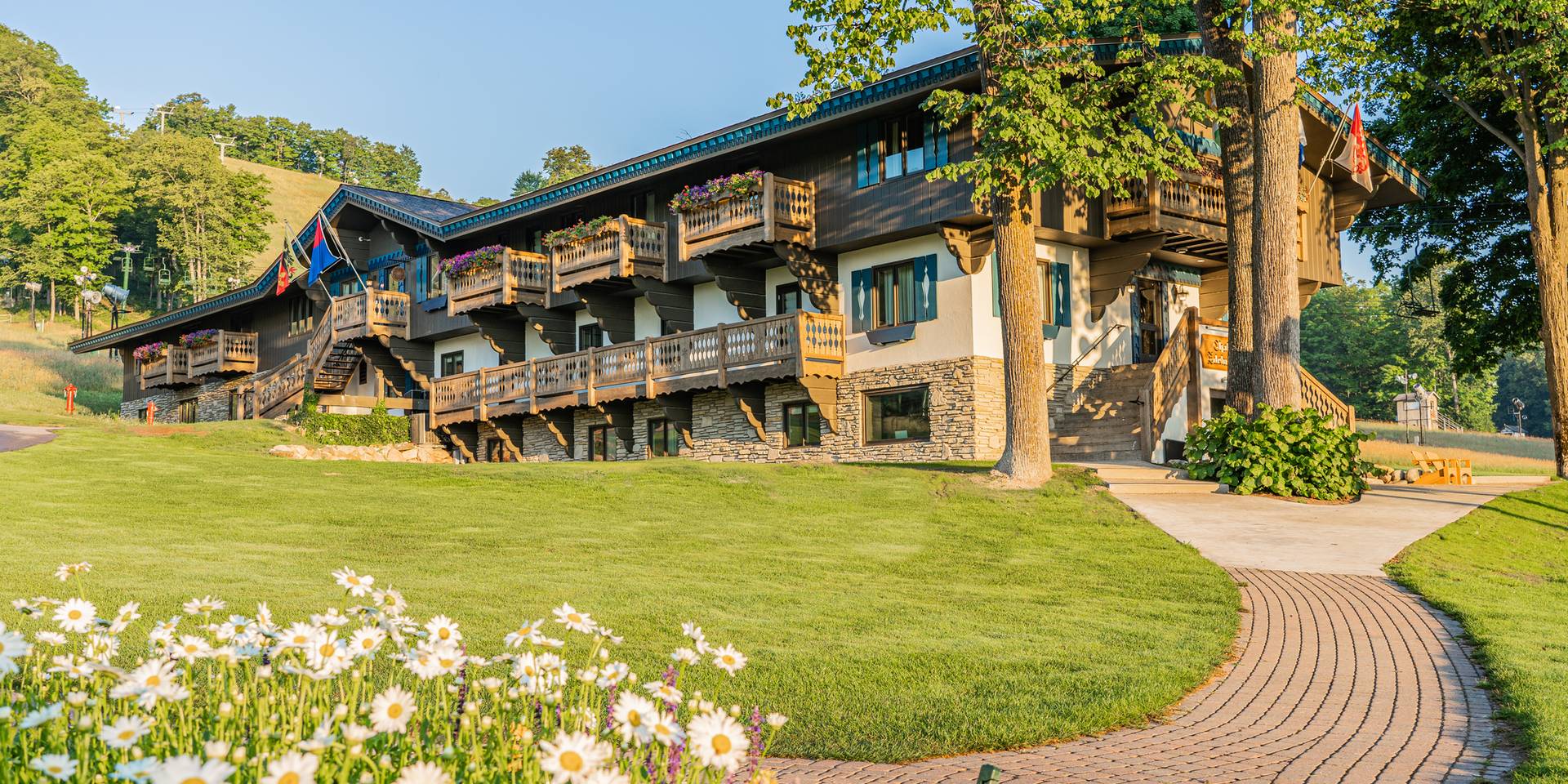 couple riding bikes by Chalet Edelwiess