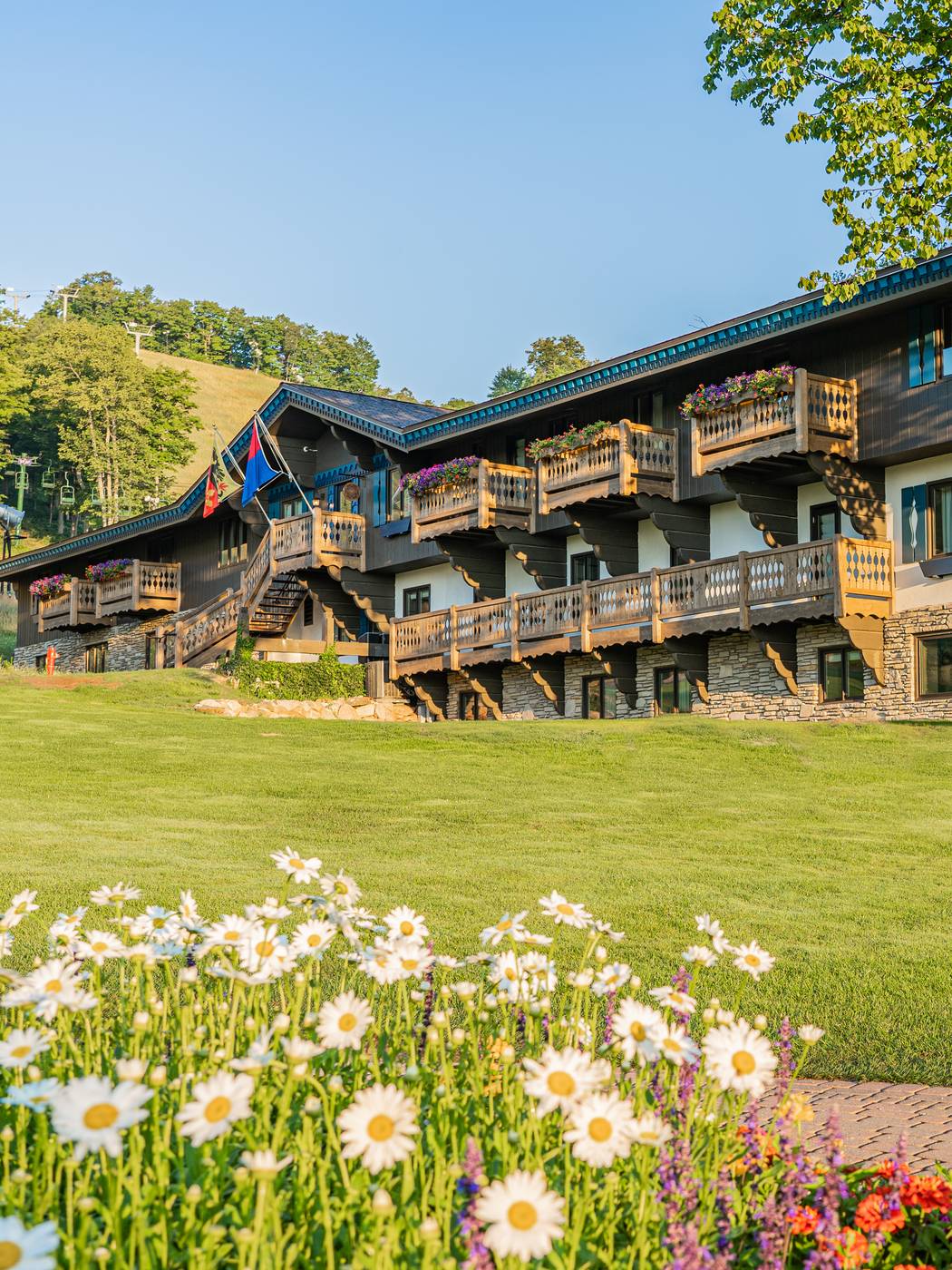 Chalet Edelweiss entrance with summer flowers