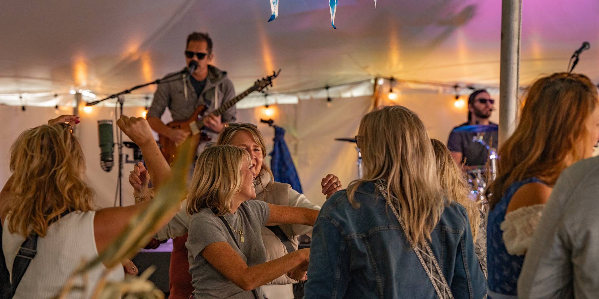 band rocking in the Skitobefest tent