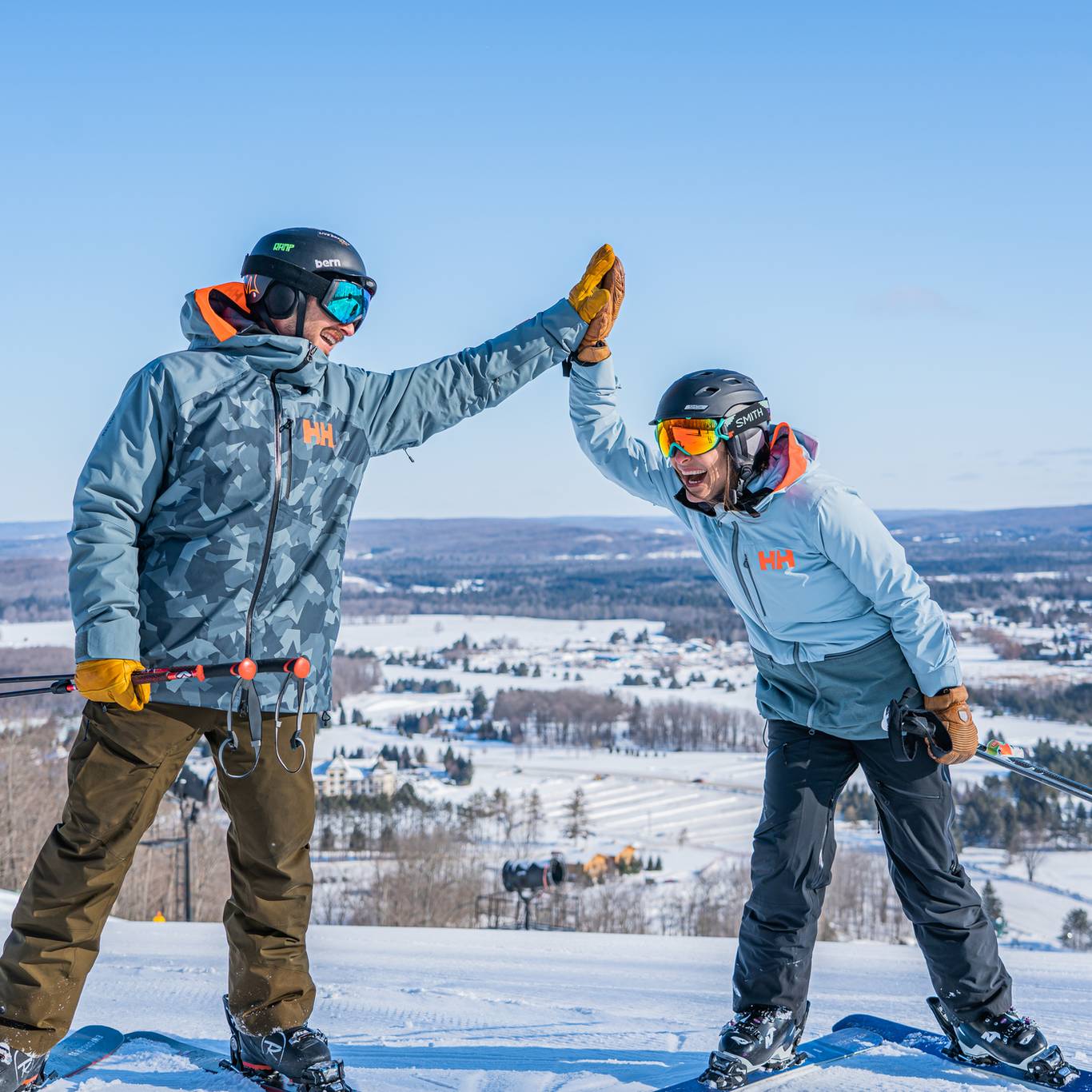 skiers high-fiving
