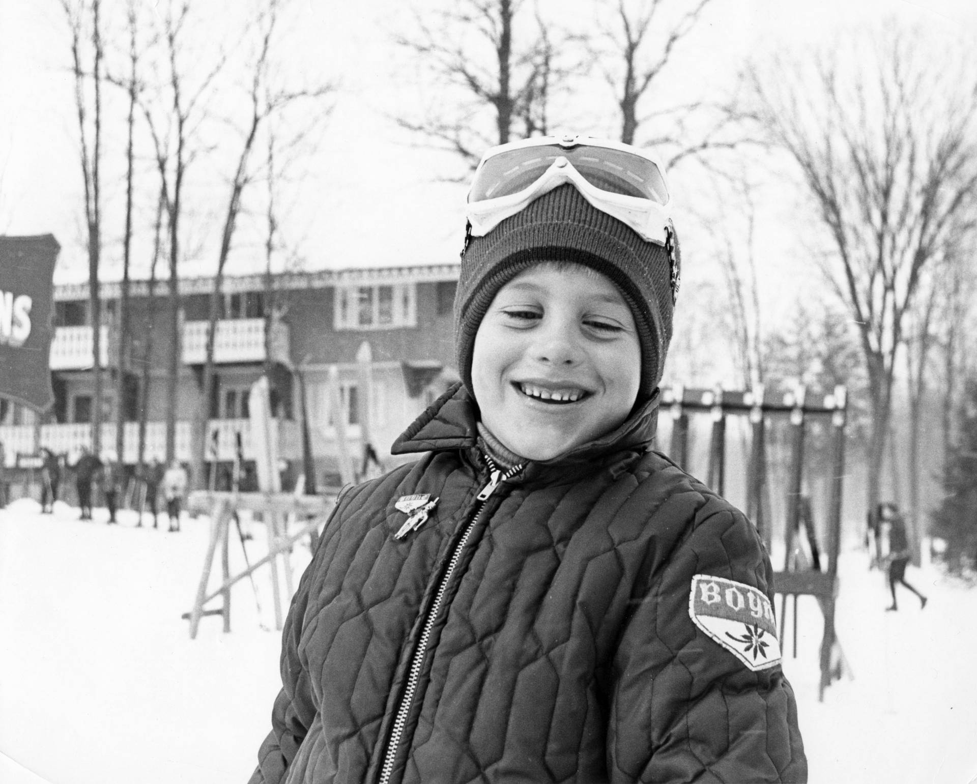 archive photo of a kid smiling at Boyne Mountain wearing a Boyne Mountain jacket