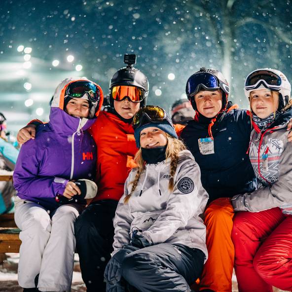 kids skiing at night