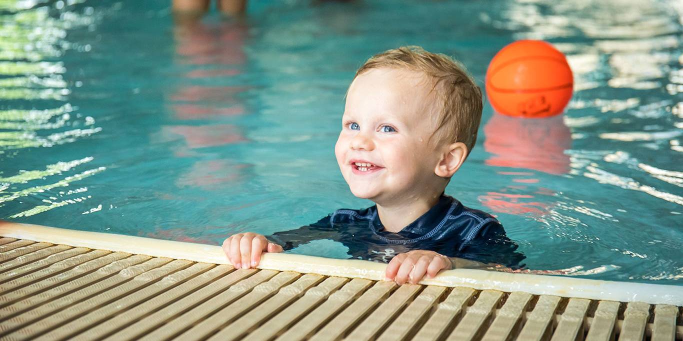 Toddler in kids pool at waterpark