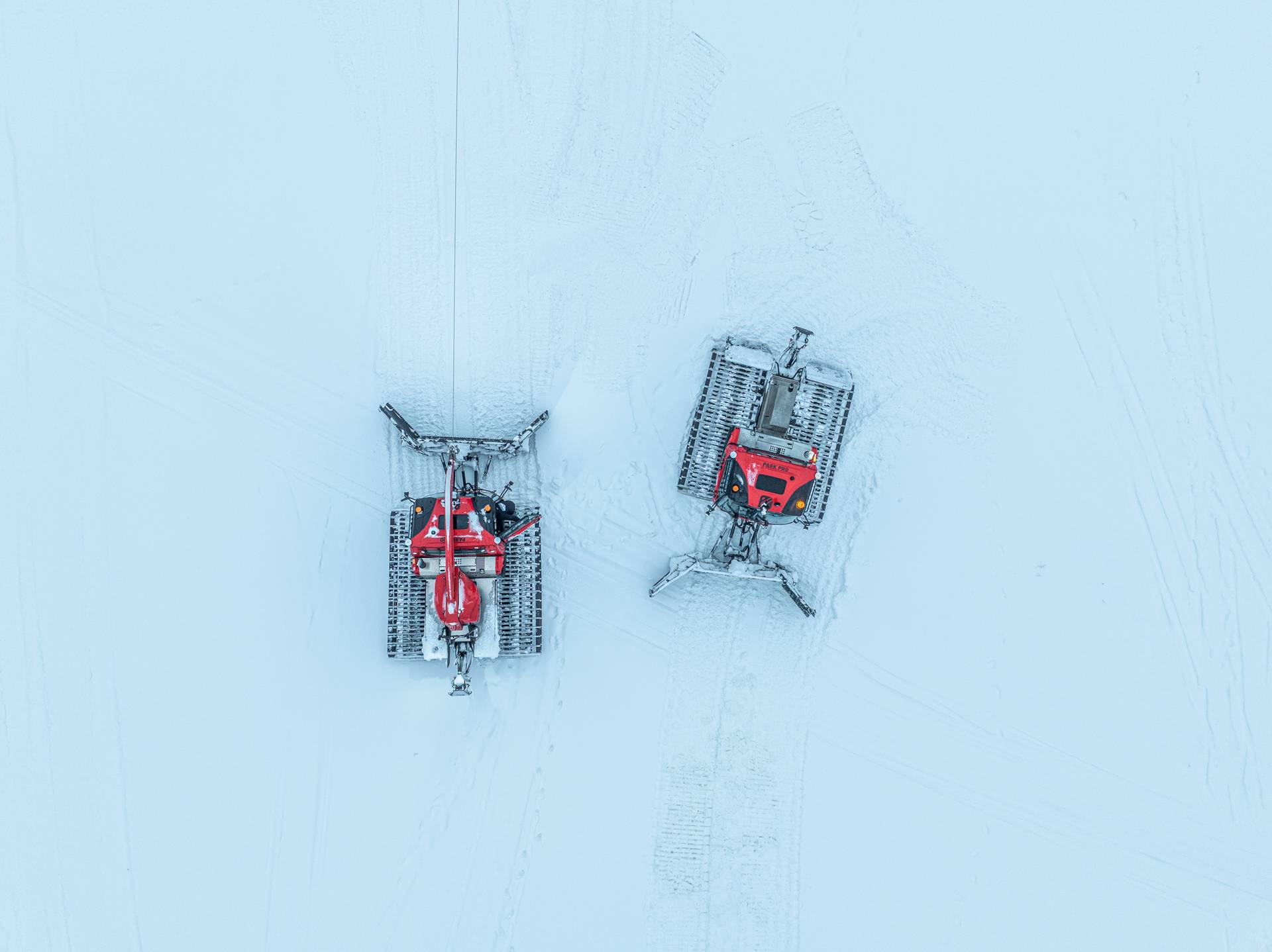 Two snow cats on the mountain