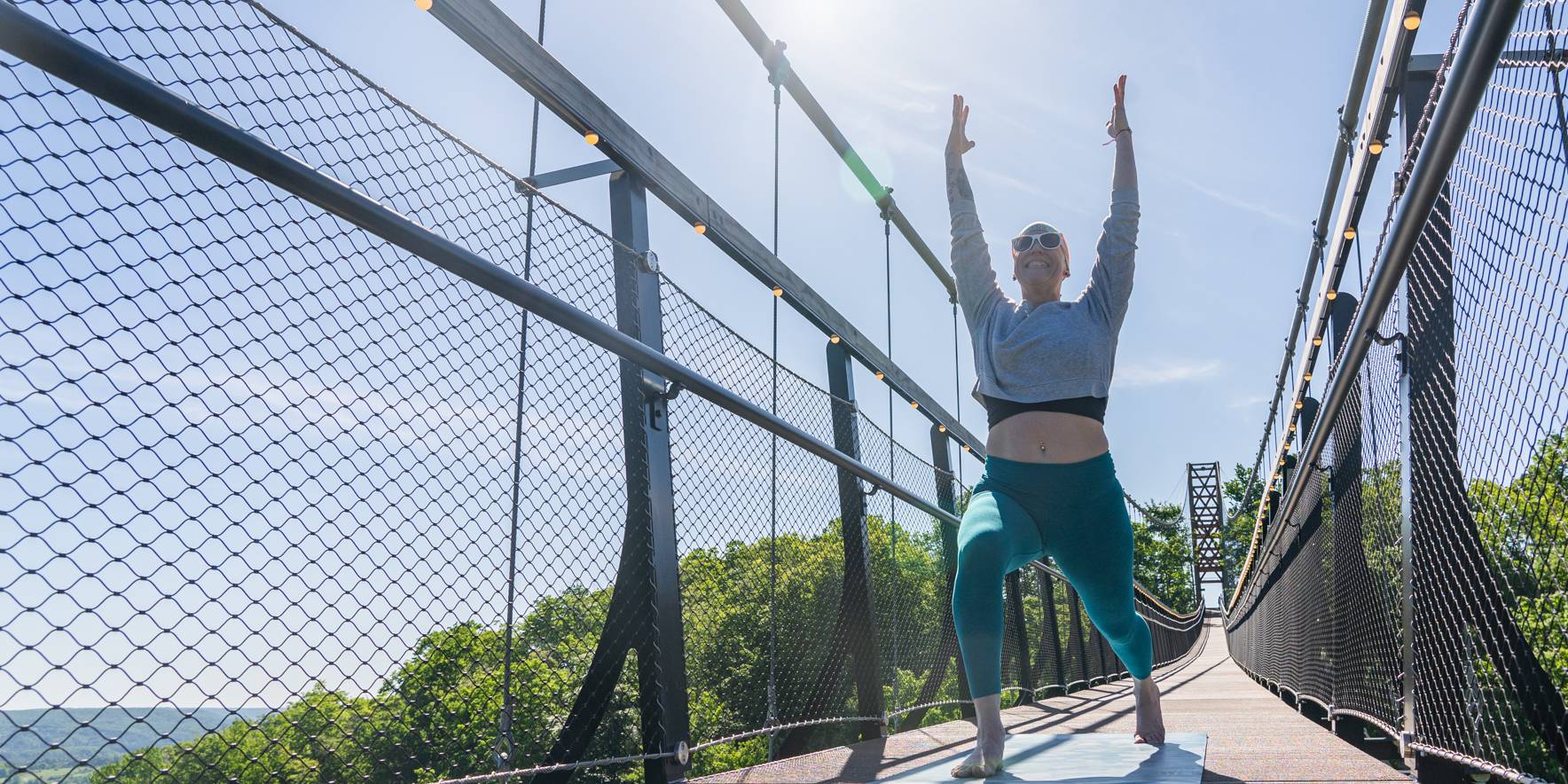 Aymey Kinney on SkyBridge doing Yoga