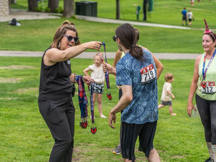 Racer getting medal after crossing finish line