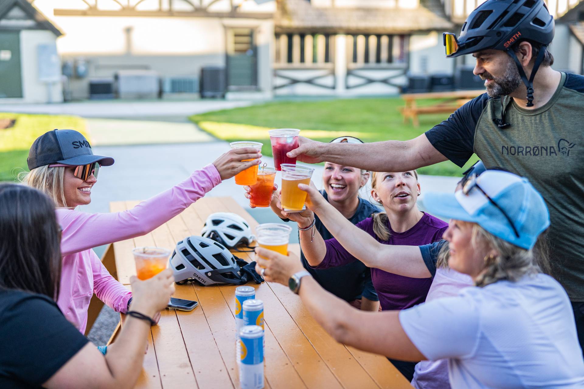 people having drinks in the back forty after riding bikes