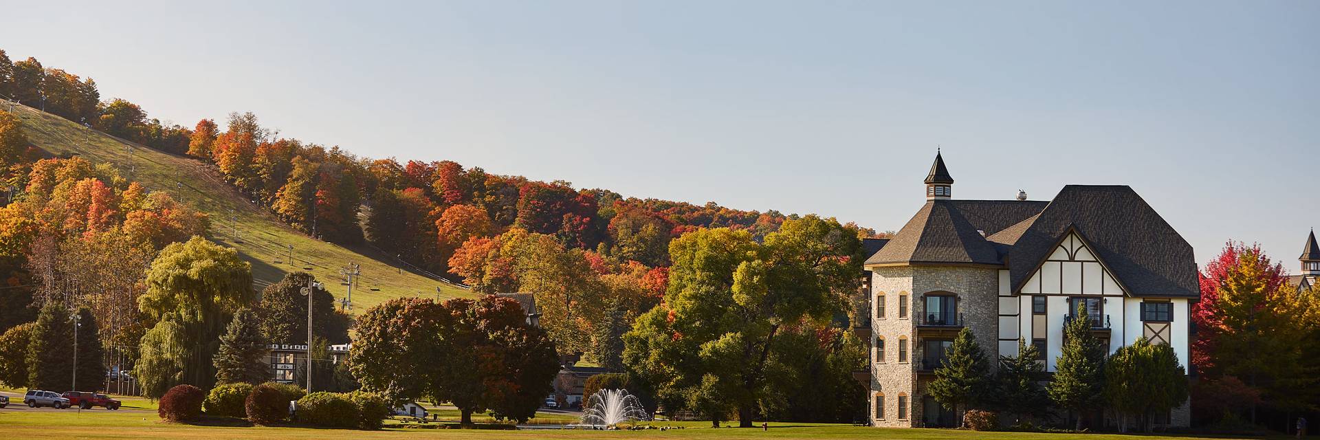 view of mountain grand lodge with fall colors