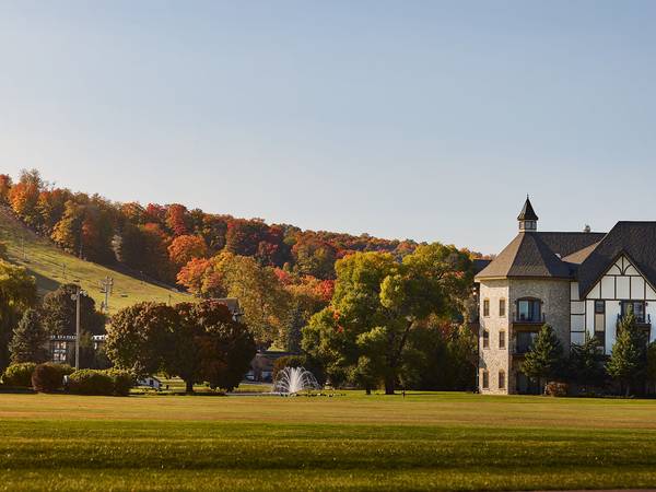 view of mountain grand lodge with fall colors