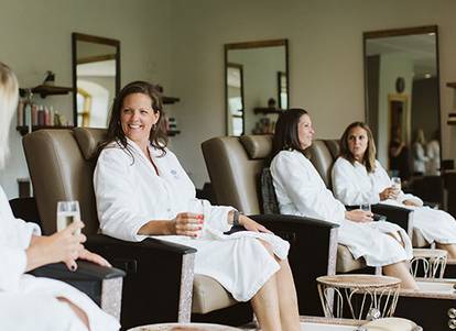 Ladies relaxing drinking champagne at the Spa at Boyne Mountain.