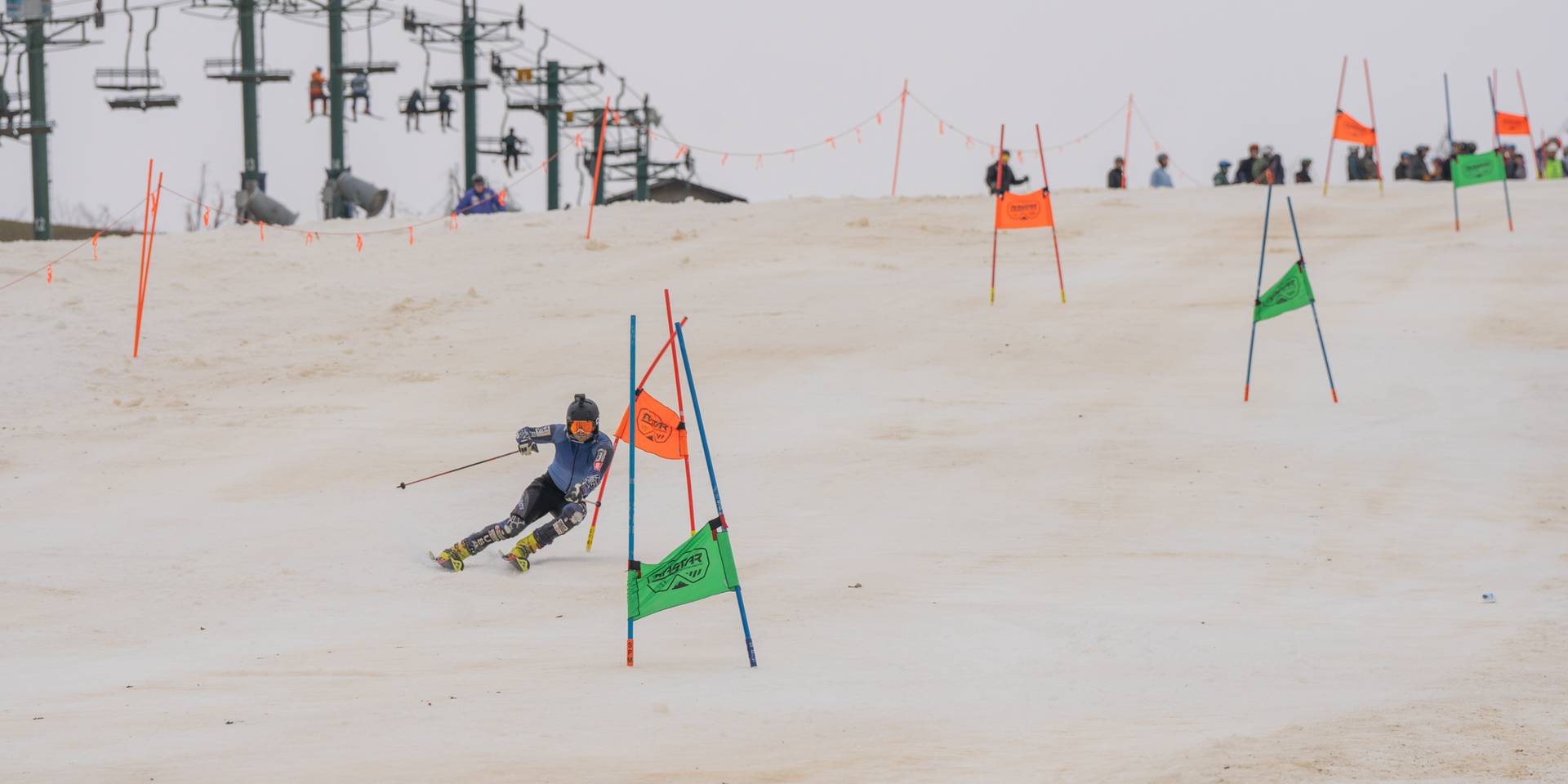 Hemlock open skier hitting the gates