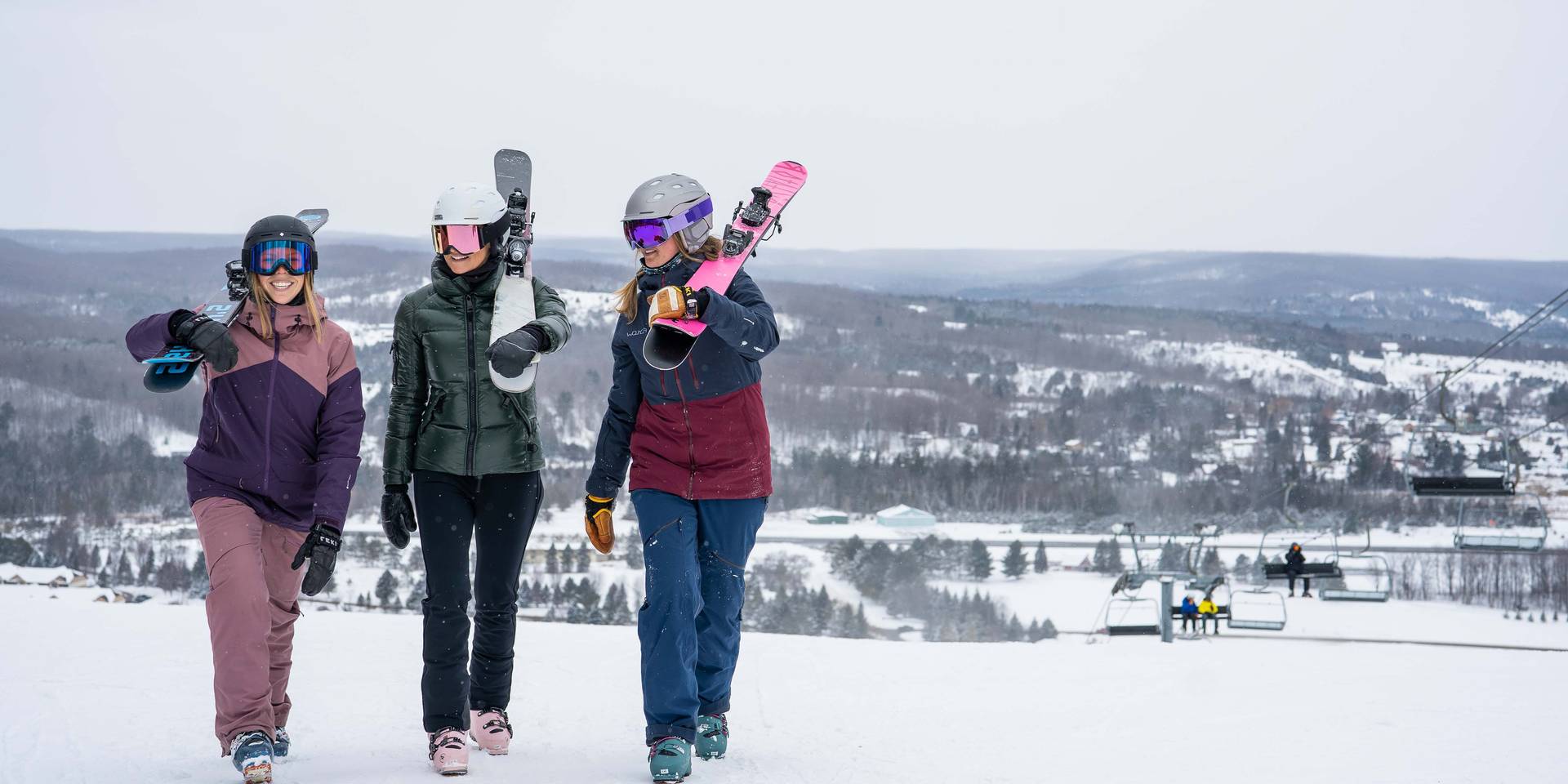 Skiers walking on hill