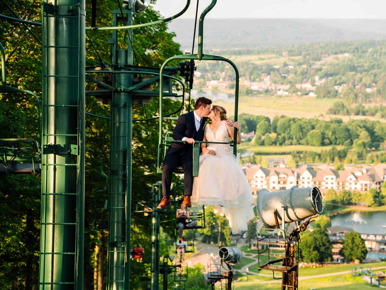 Wedding Couple in Chairlift Kissing