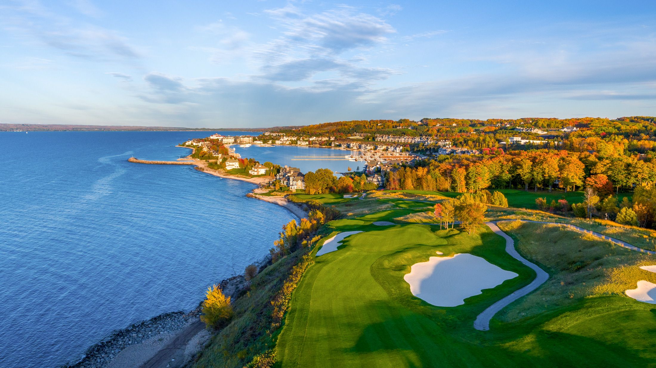 Aerial Bay Harbor Golf Club The Links course along Lake Michigan on autumn day