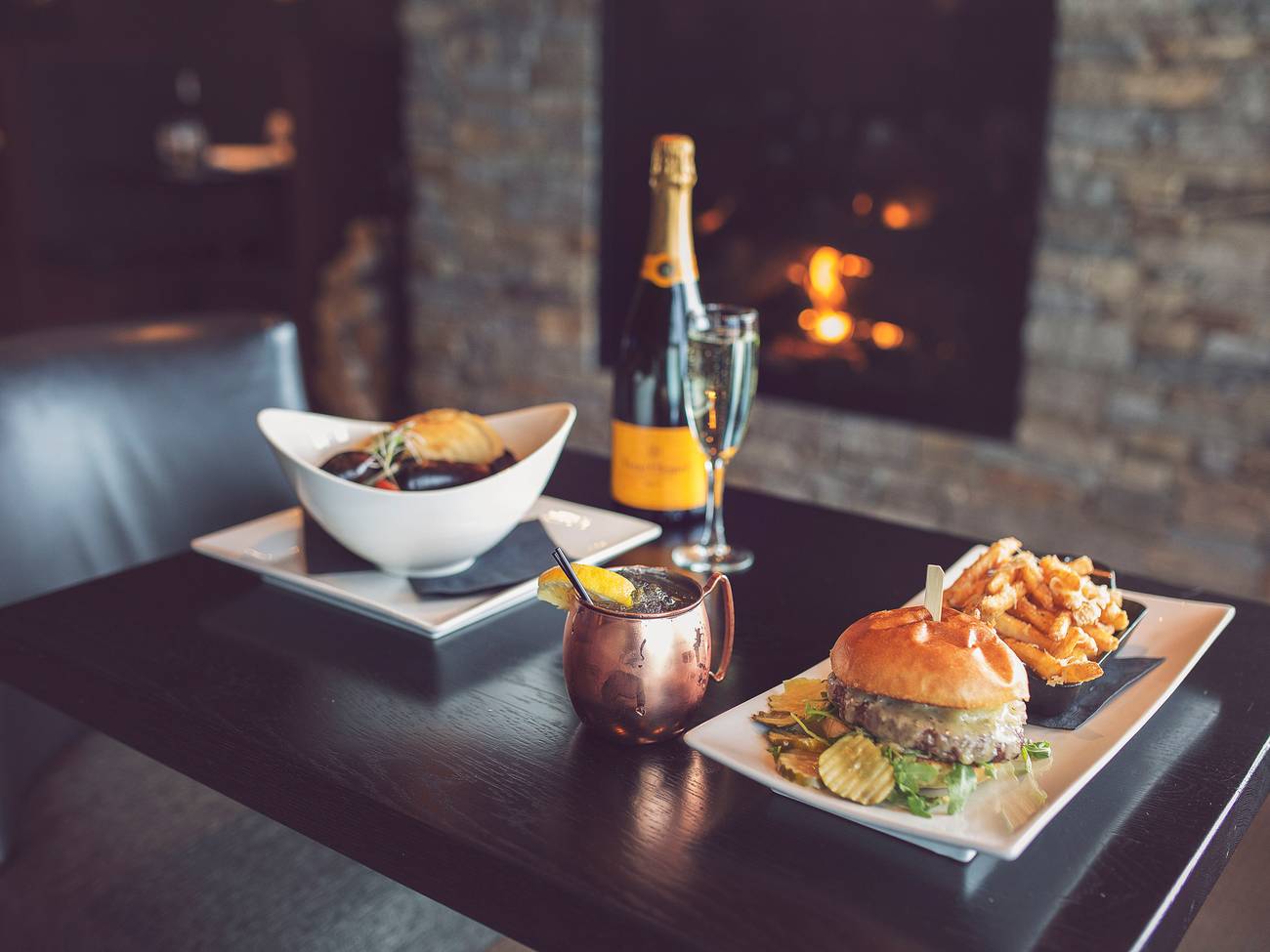 A burger and mussels on a table at Vintage