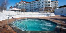 Bubbling blue hot tub near Inn at Bay Harbor on sunny winter day