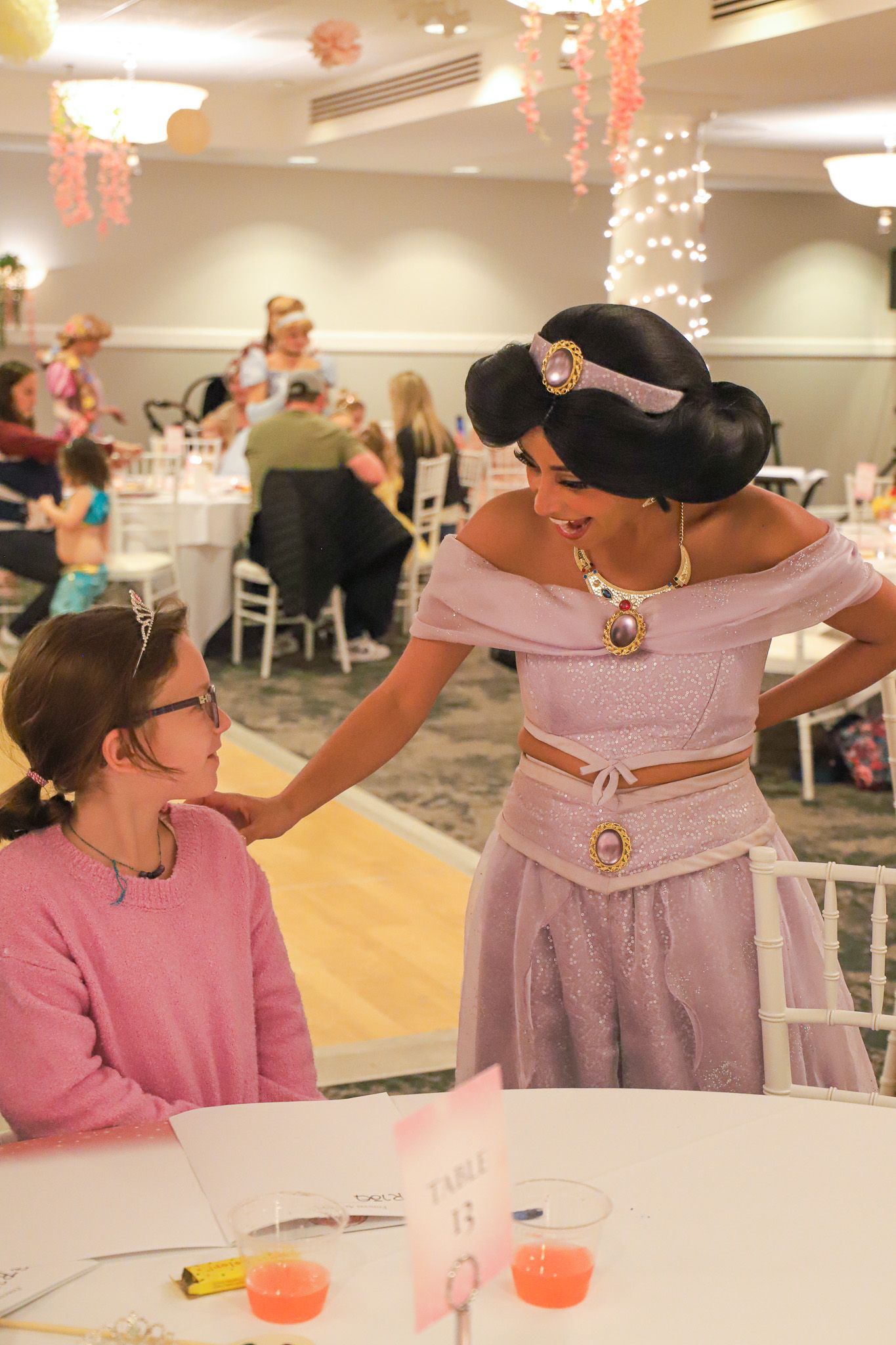 Princess Jasmine character chats with guest, Inn at Bay Harbor