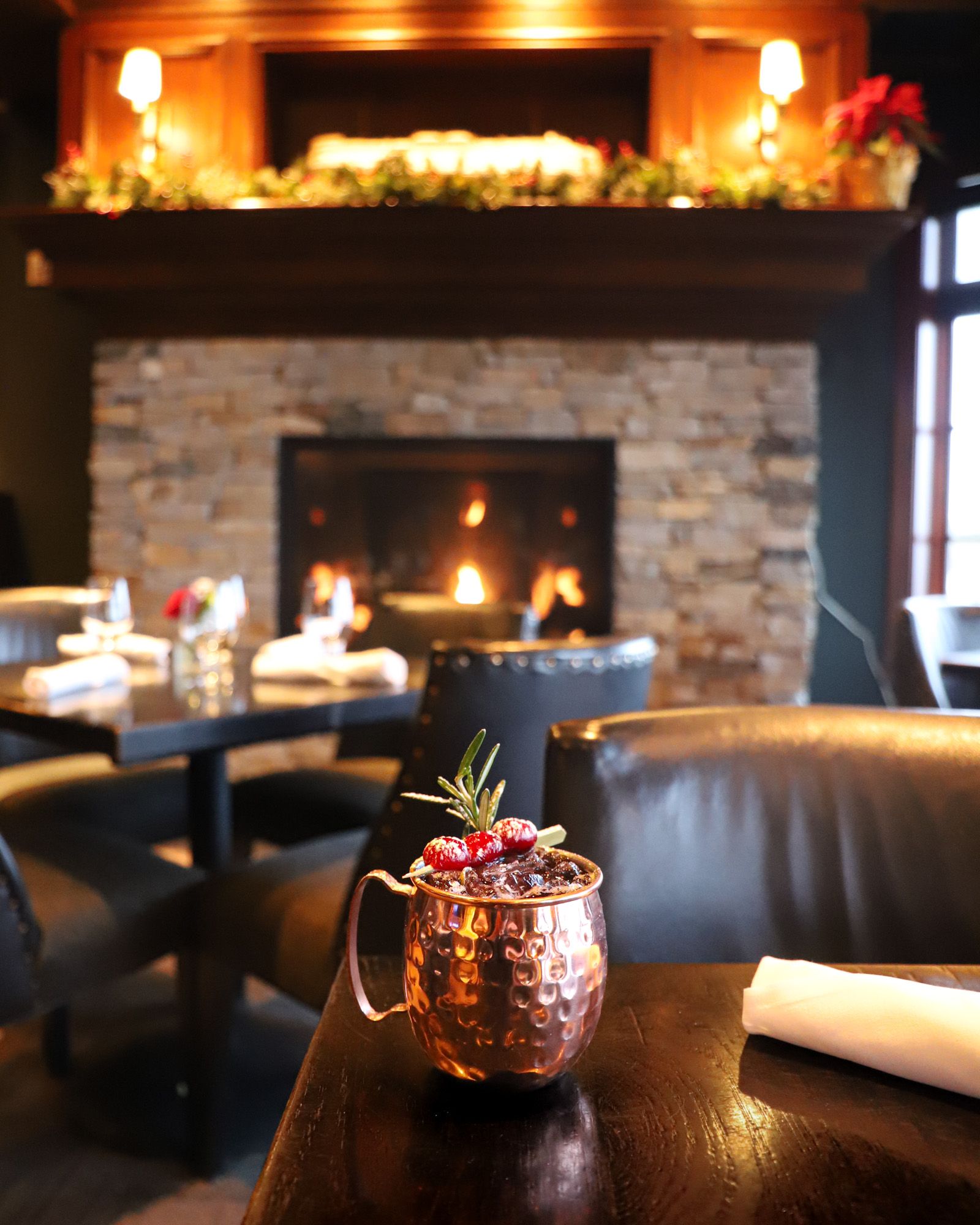 Holiday Moscow Mule copper mug in front of Vintage fireplace