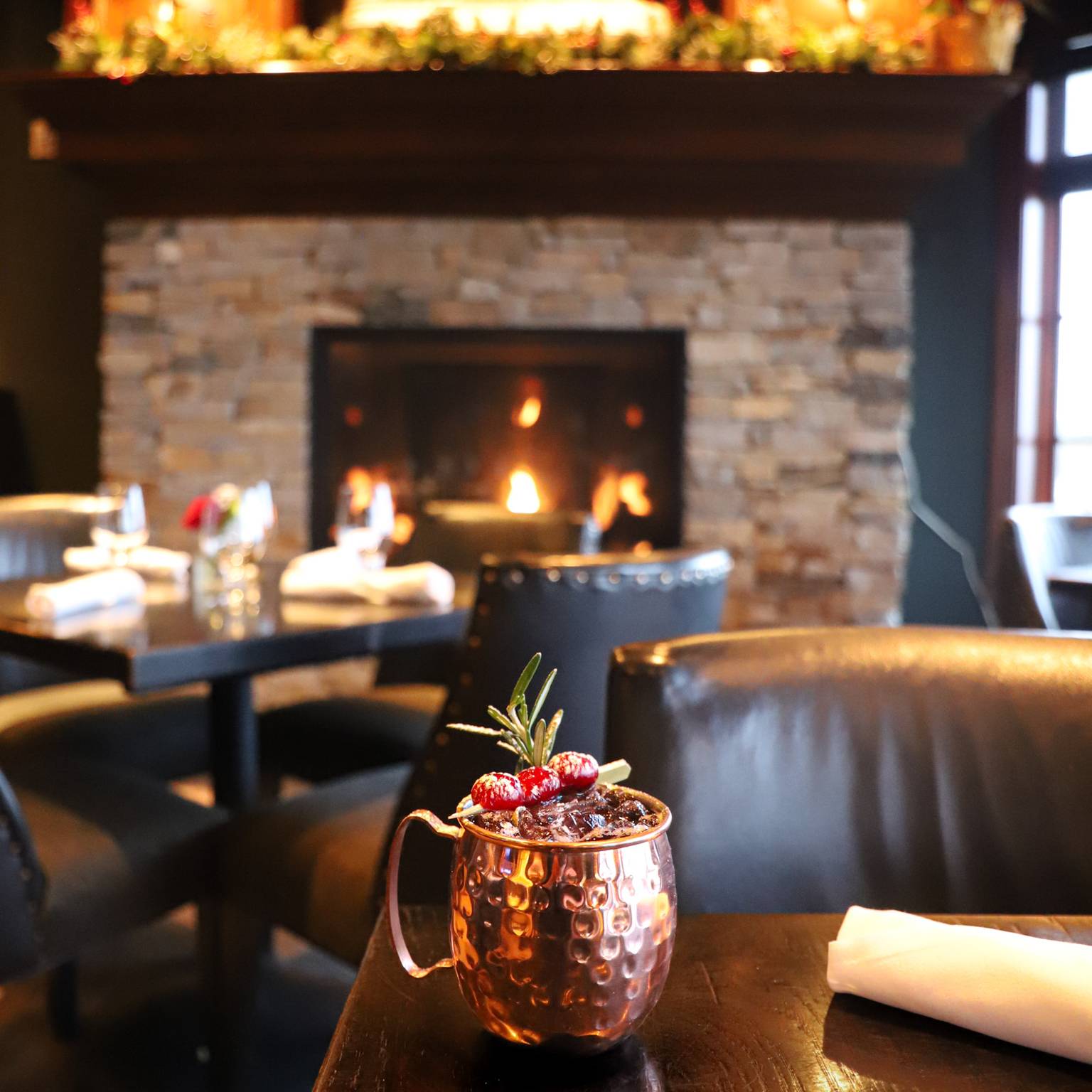 Holiday Moscow Mule copper mug in front of Vintage fireplace