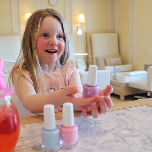 Little girl smling with nail polish at The Spa