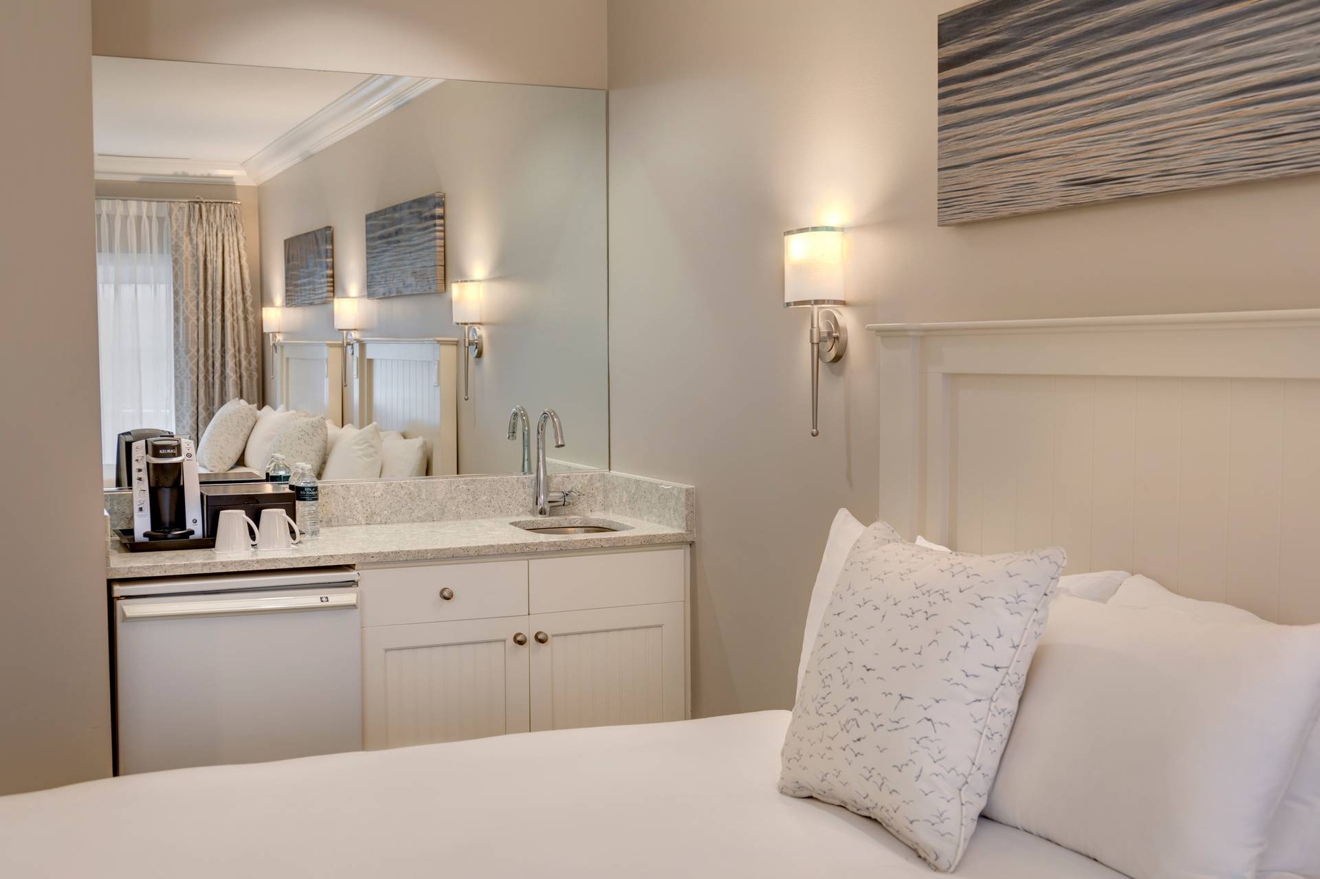 Guest room wet bar and corner of bed