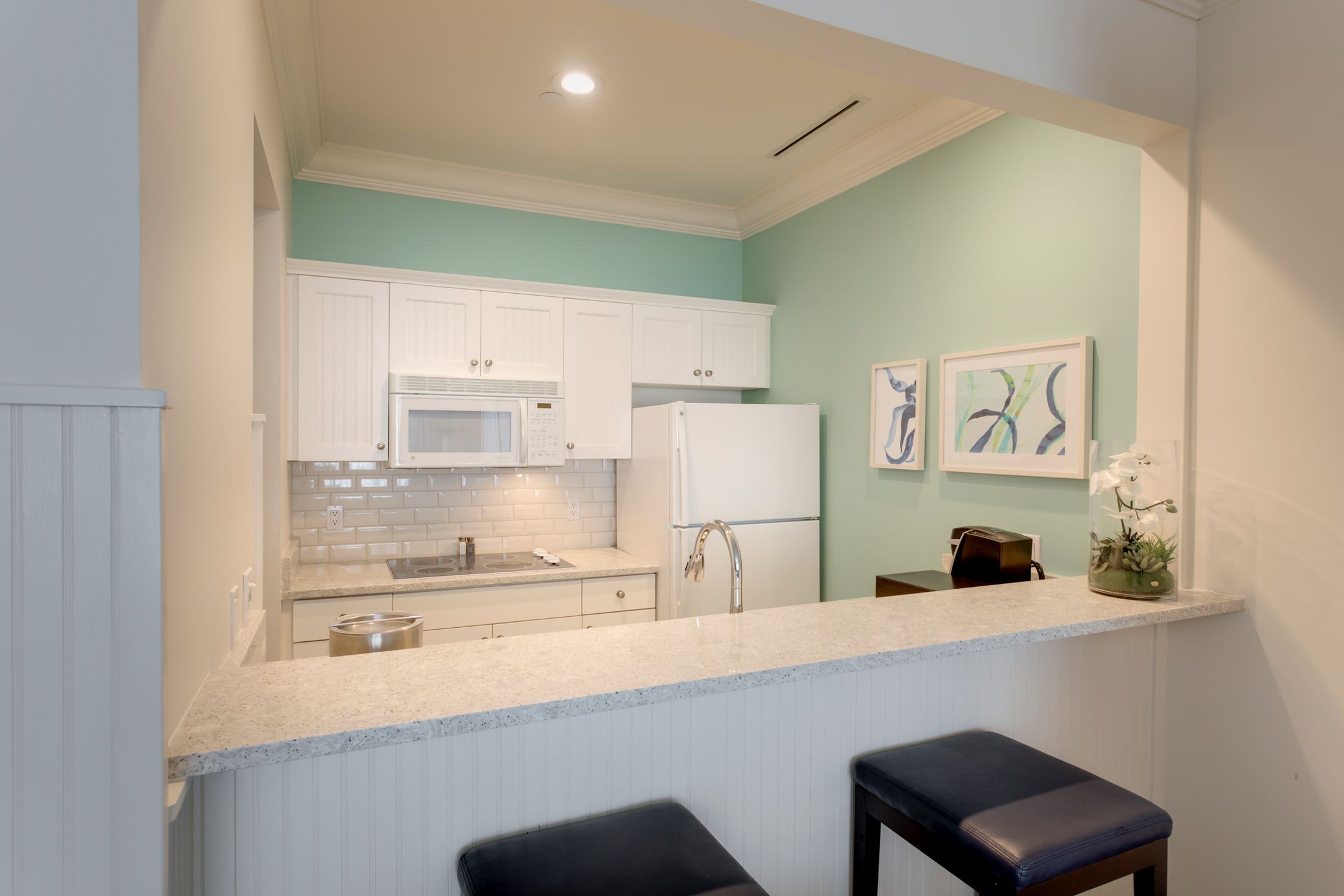Hotel room breakfast bar and light blue kitchen details, Master Suite