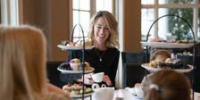 Laughing mother enjoys Afternoon Tea with children, Inn at Bay Harbor